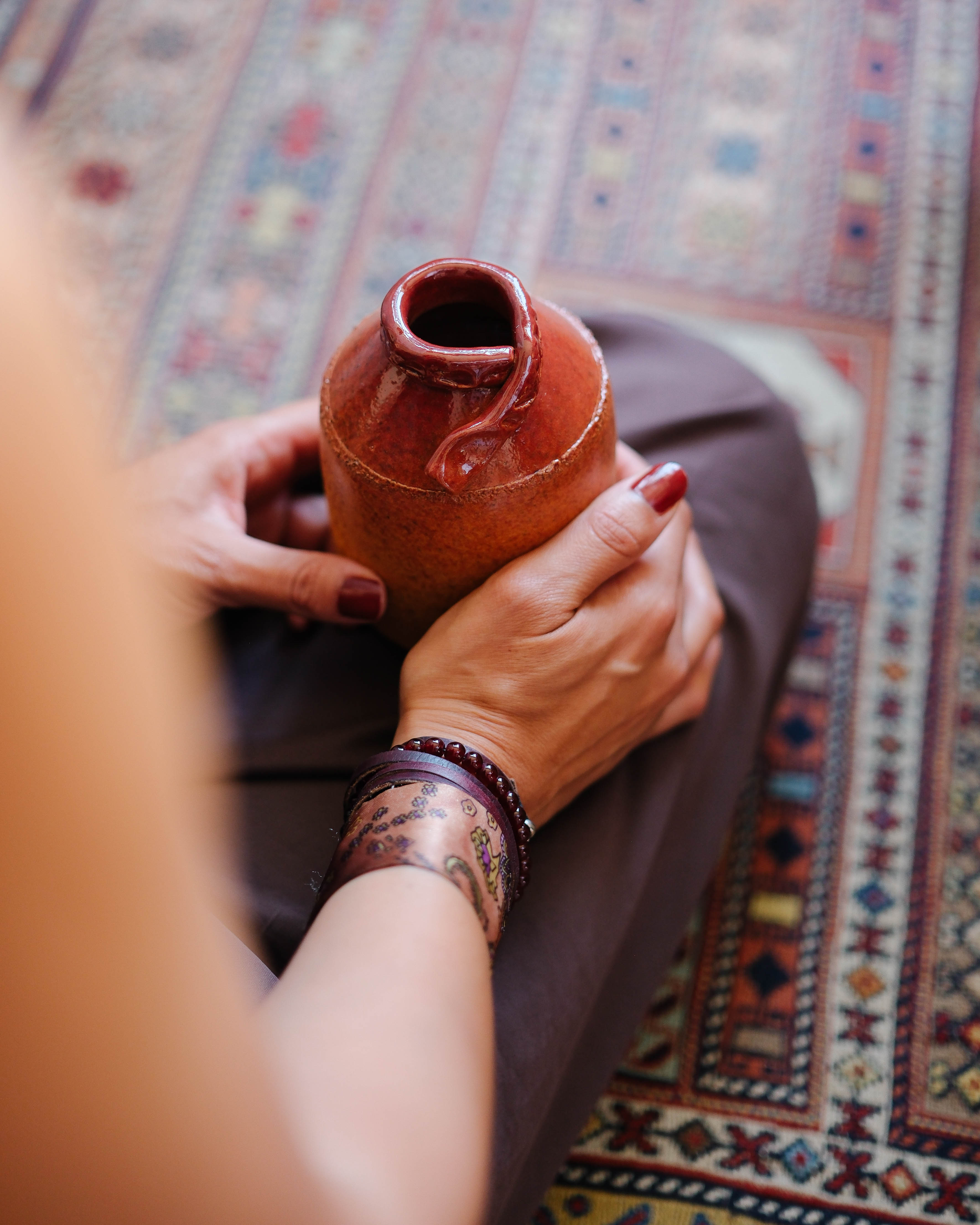 Artist holding a vessel